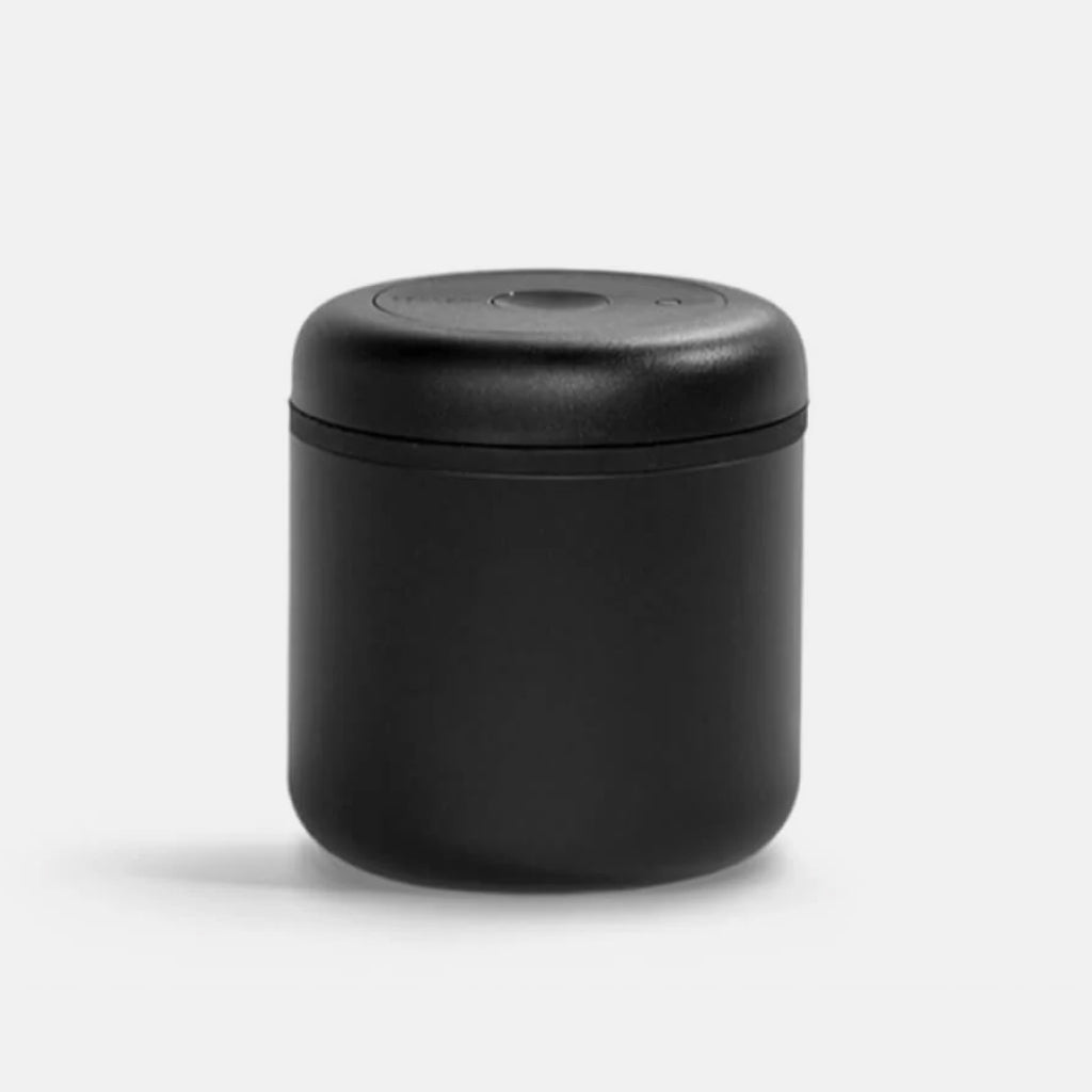 Matte black Fellow Atmos canister with 0.7L capacity and a black lid with rounded edges.