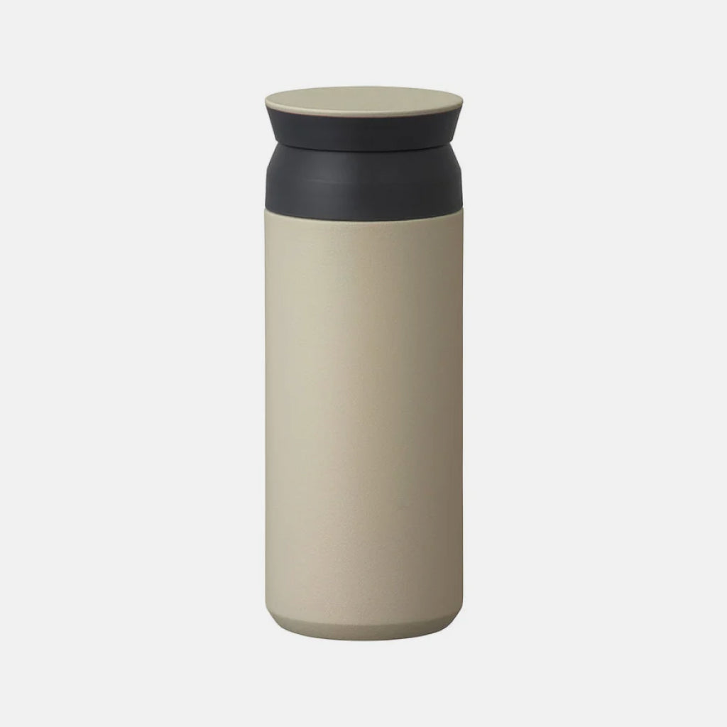 Kinto Travel Tumbler with 500ml capacity in Sand Beige with a black neck band and lid with a sand beige cap.