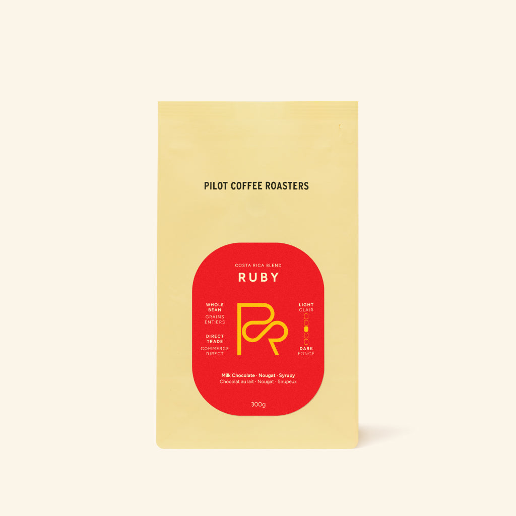 Ruby Costa Rica Blend coffee bag with warm yellow packaging and bold red label