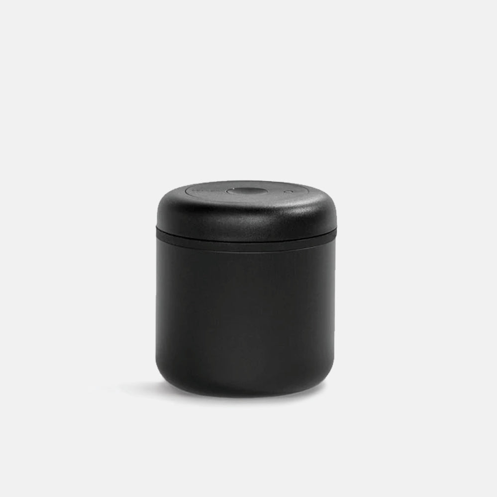 Matte black Fellow Atmos vacuum canister with black lid with rounded edges