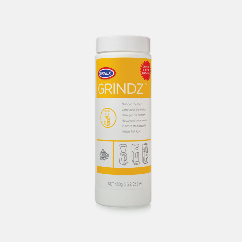 Urnex Grindz grinder cleaner bottle with yellow label and white cap