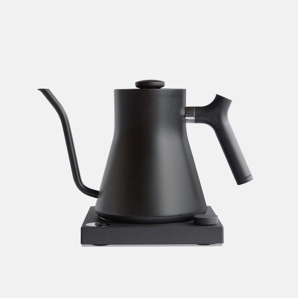 Fellow Stagg EKG Pro electric gooseneck kettle in matte black on a base with a control knob
