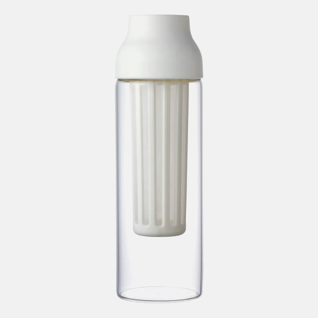 Tall clear glass Kinto Capsule Cold Brew Carafe with white lid and built in filter.