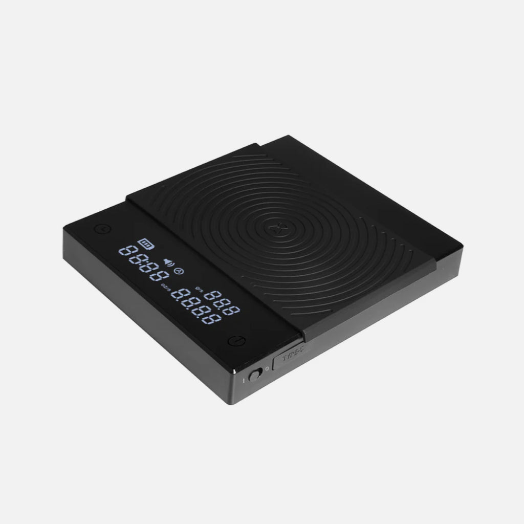 Black Timemore Basic 2 scale with black silicone mat and LCD lit display screen.