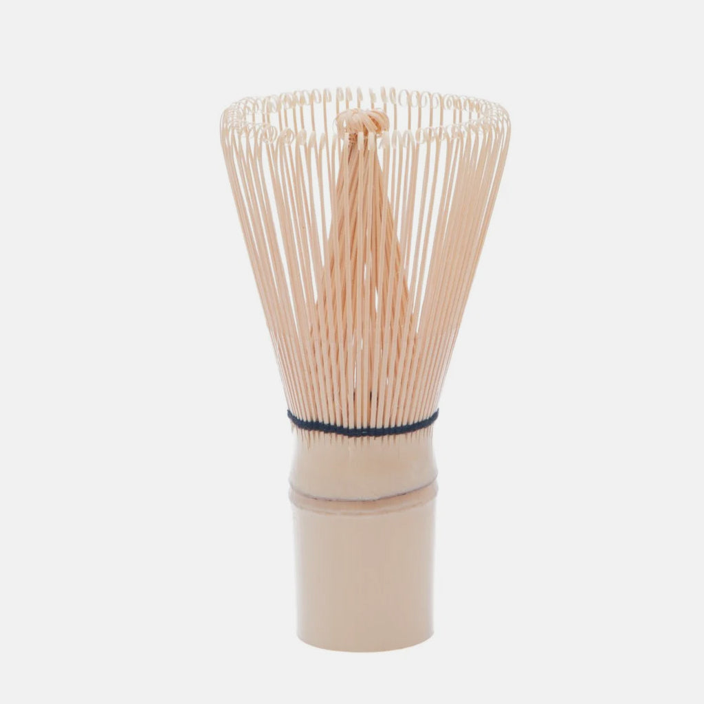 Natural bamboo chasen whisk with slender tines used for whisking matcha